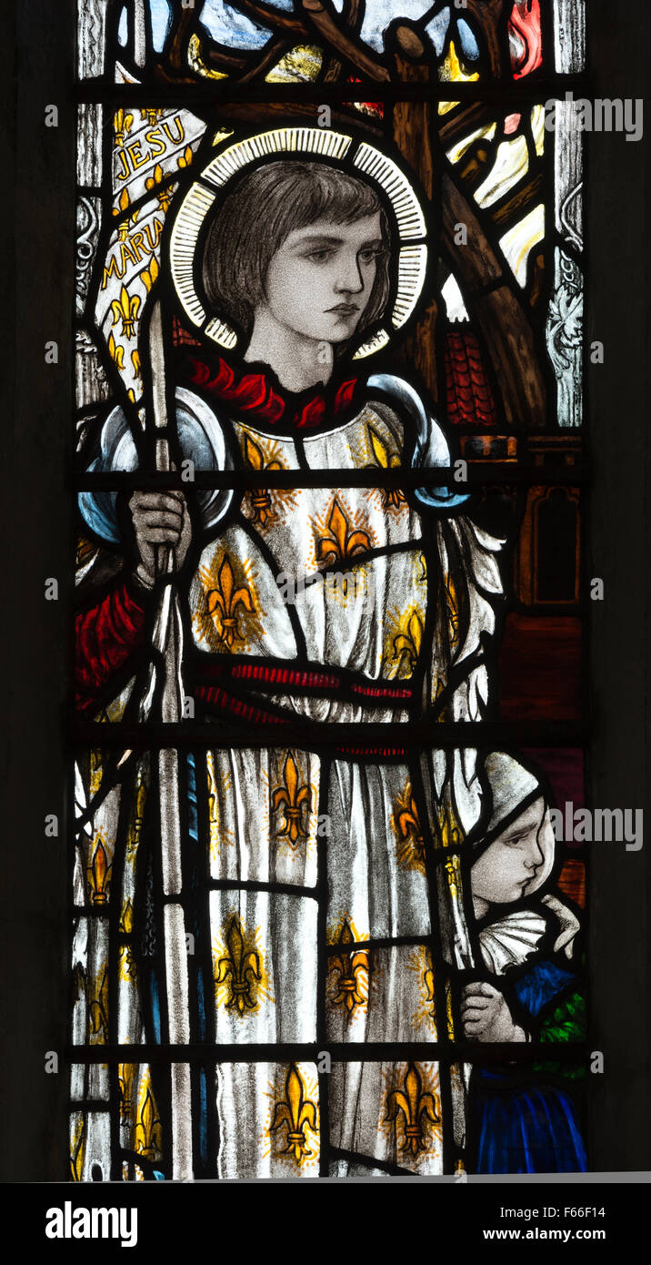 Saint Joan of Arc stained glass by Christopher Whall, St. Leonard`s Church, Apethorpe, Northamptonshire, England, UK Stock Photo
